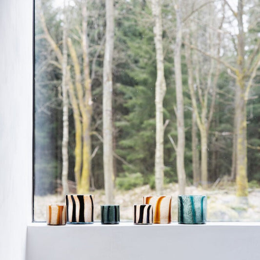 Handmade glass votives in organic shapes with fantastic curves in contrasting colours by Byon
