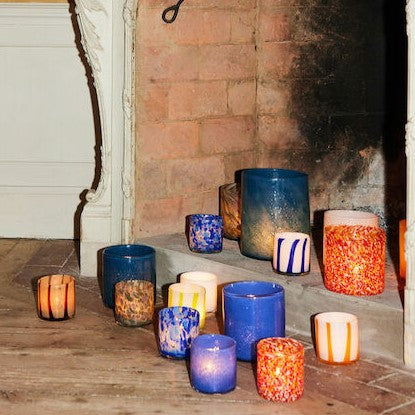 Handmade glass votives in organic shapes with fantastic curves in contrasting colours by Byon.