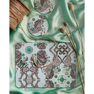 Caspian animal coasters and placemat in Teal by Emma J Shipley for Jamida of Sweden