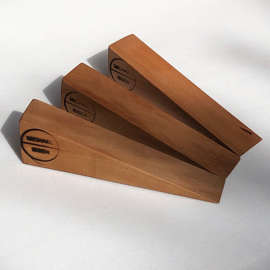 Wooden door wedges handcrafted from English pear wood by Michael Ibsen