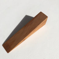 Wooden door wedge handcrafted from English pear wood by Michael Ibsen