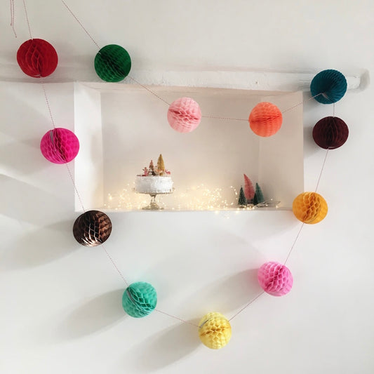 Multi-coloured paper ball garland by Petra Boase