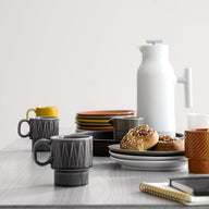 Accent white tea and coffee jug designed by Gustav Hallén for Sagaform
