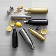 Nils double walled stainless steel bottles in gold, silver and black Large H30cm 75cl by Sagaform
