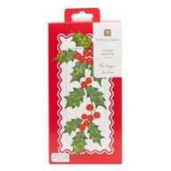 Talking Tables paper napkins in a red and white holiday-themed box decorated with holly leaves and red berries.