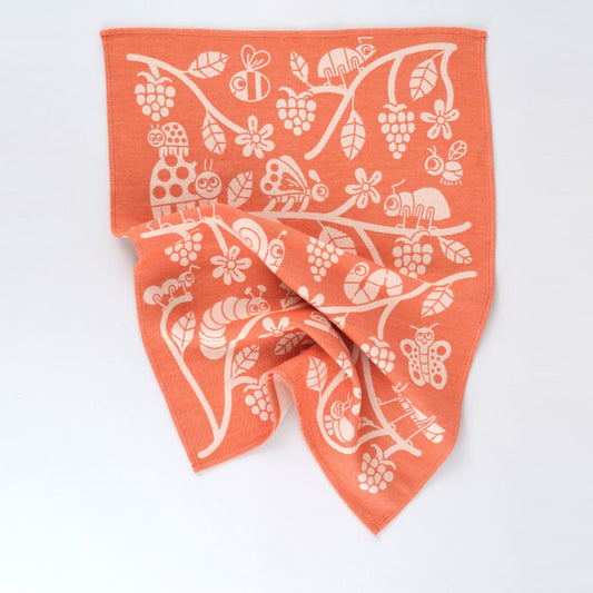 Wrap Tea Towel Bugs and Brambles in orange and white