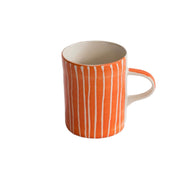 Musango handmade Sgraffito pattern Demi Mug in tangerine